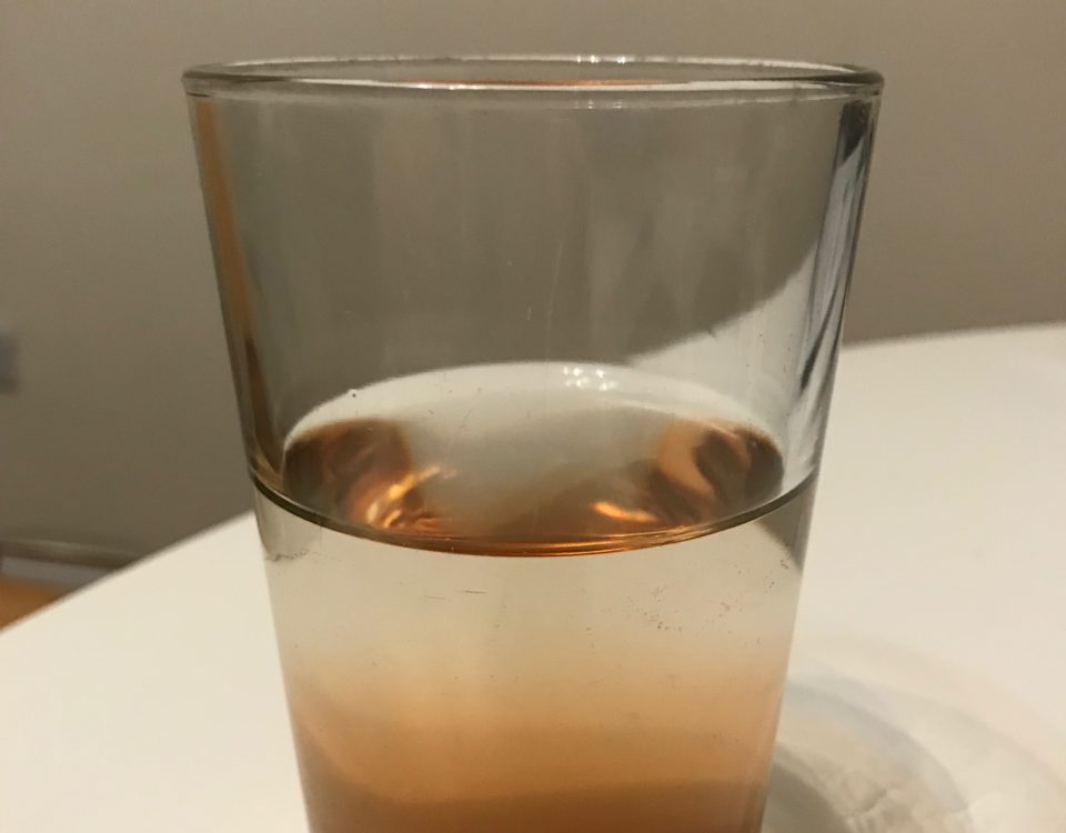 Glass half full of liquid